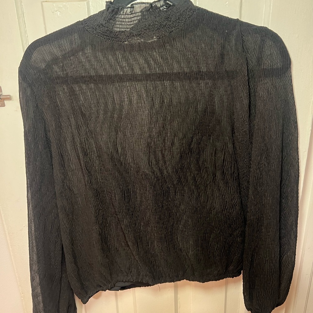 Sassy black top with sheer overlay and black cami